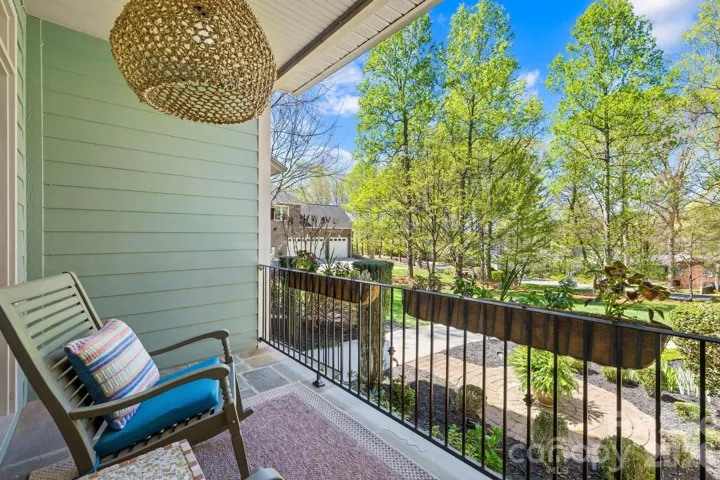 Private balcony overlooking the sprawling front yard. 