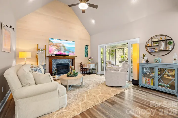 This cozy sitting room or keeping room has its own fireplace.