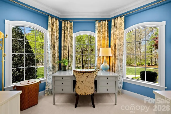 One of two walk-in closets in primary bedroom.