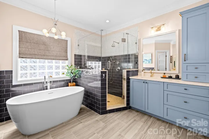 Beautifully done tiled walk-in shower plus a soaking tub,