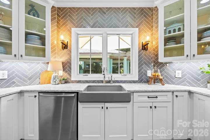 The farmhouse sink overlooks the outdoor living space.
