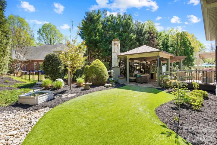 River rock and green space (AstroTurf) for easy maintenance. 