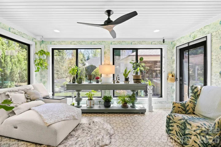 This sunroom is our favorite spot and connects to the outdoor living space.