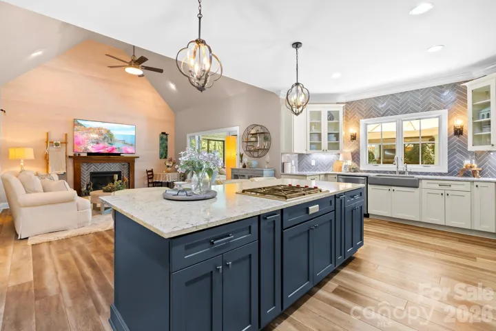 We just love this oversized island with seating and gas cooktop.