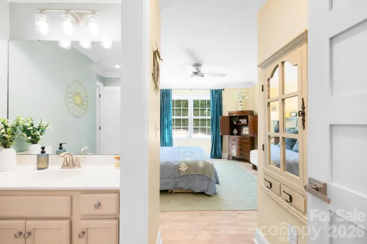 Separate vanity connects to the 3rd bedroom.