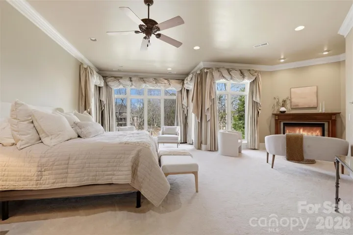 Primary suite on the main. Fireplace, sitting area, proportions that leave nothing to want.