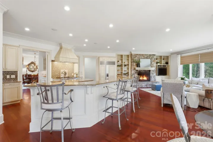 Oversized island, bar seating, custom cabinetry to the ceiling. Built for someone who actually cooks.