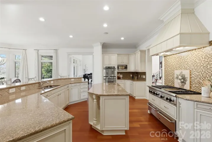 Premium appliances, statement hood, Simonini finishes throughout.