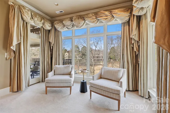 Primary bath, soaking tub, dual vanity, natural stone.