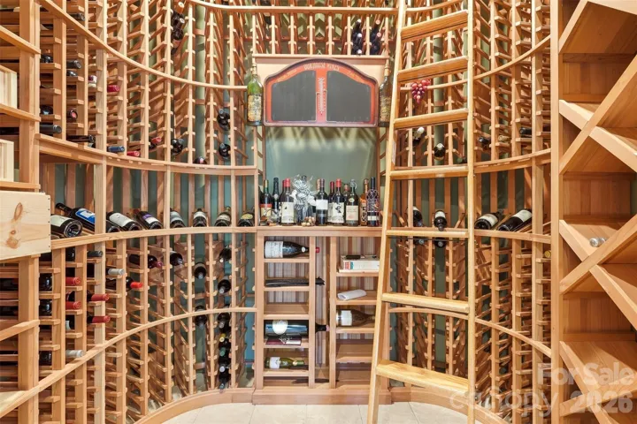 The wine cellar. Floor-to-ceiling custom racking. This is the room that stops every buyer.
