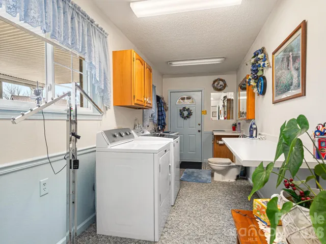 Laundry/mudroom with a quick relief station!