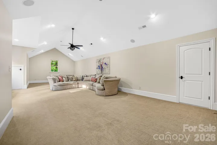 The Rec room  includes a work out area, super comfy Henredon sectional (which conveys) for movie nights, and room for a ping pong/game table.  Additional walk-in storage is available on both sides of the room.