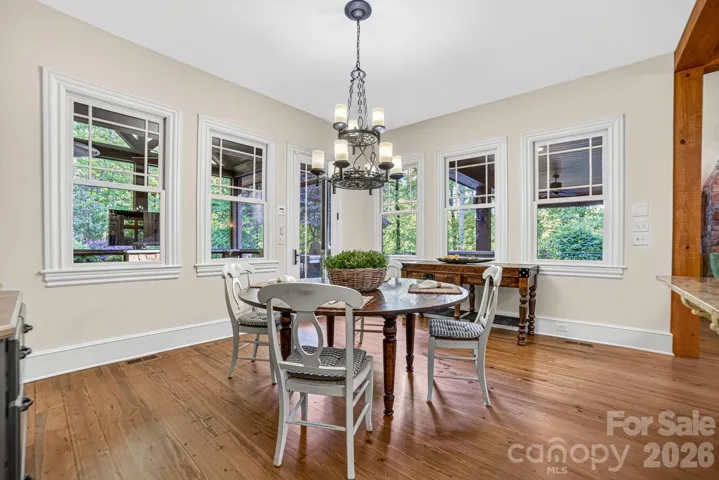 The informal dining area has plenty of room for seating for 8 and has a built-in hutch for storing dishes and favorite pottery