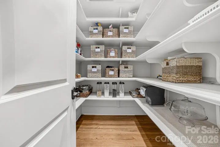 The extra-large walk-in pantry has built-in shelving up to the ceiling.