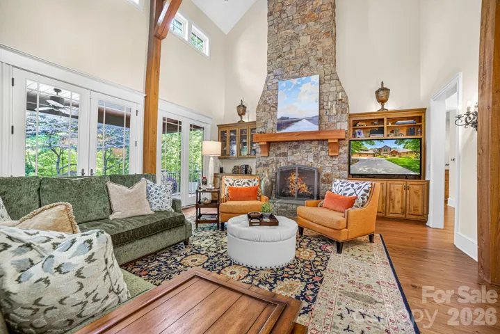 Inside, soaring hammer-beam trusses, an impressive gas log stone fireplace and handcrafted Alderwood built-ins define the breathtaking Great Room