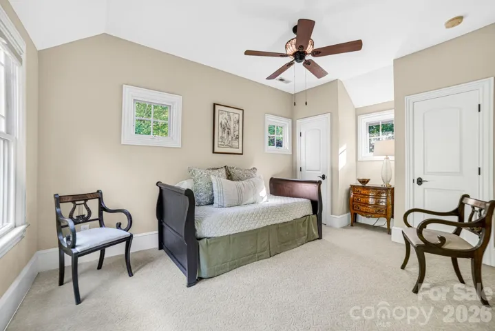 3 additional bedrooms (two with ensuite bathrooms) complement the upper level. All upper level bedrooms include plush carpeting, ceiling fans with lights and spectacular scenic windows