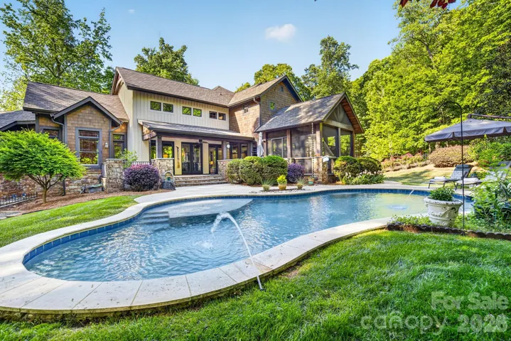 A new and improved PebbleSheen pool & spa with limestone coping (2023) and updated pool equipment, with tanning ledge & umbrella stand is surrounded by an expansive fenced backyard embraced by Dogwoods, Tulip Poplars, Redbuds, Japanese Maples & Oak trees.