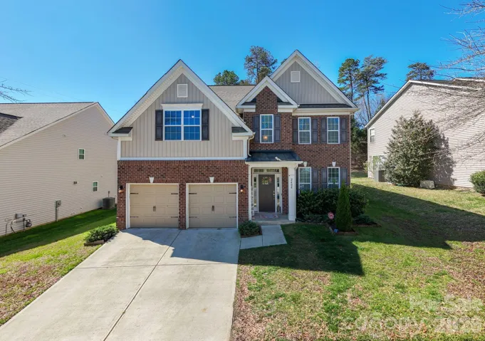 Beautiful curb appeal with spacious driveway and well-maintained exterior