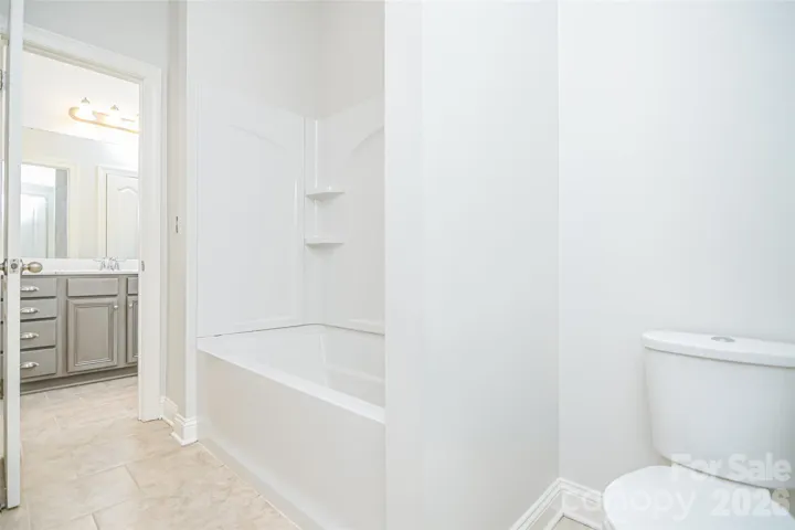 Shared ensuite. Dual entry bath bedroom 2 and bedroom 3.