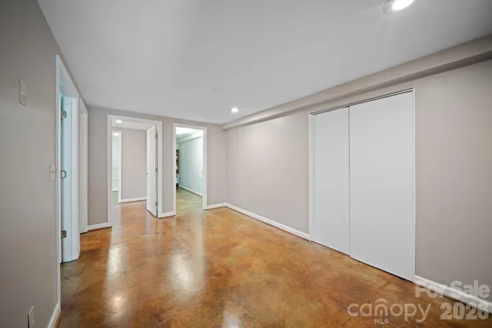 View of lower level living room kitchen/dining area.
