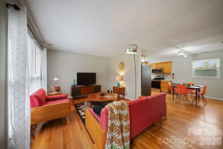 Living room with view into dining area and kitchen.
