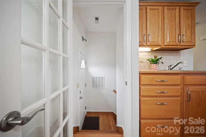 Interior entrance to lower level/back door leading to deck.