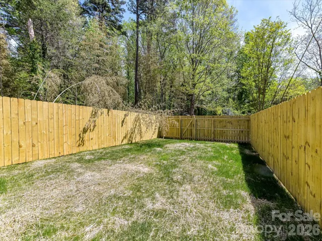 Sizeable fenced backyard offering privacy and plenty of room for outdoor entertaining, pets, or play.