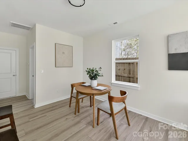Bright and cozy breakfast nook with abundant natural light, offering the perfect spot for casual dining and morning coffee.