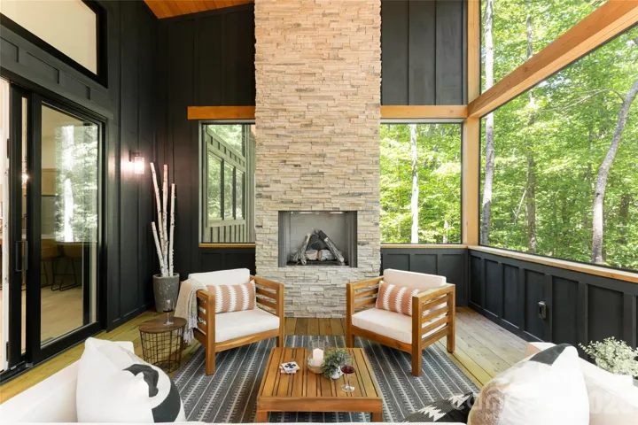 IT'S PORCH TIME! Screened-in wiith a stacked stone fireplace. We challenge you to find a better one!