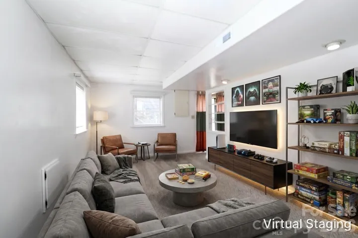 Virtually staged rec room on lower level