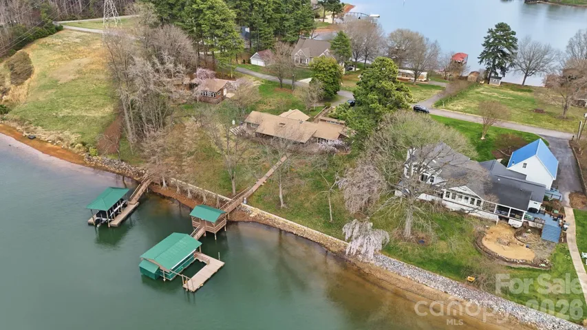 Aerial showing potential water views front and rear of home..