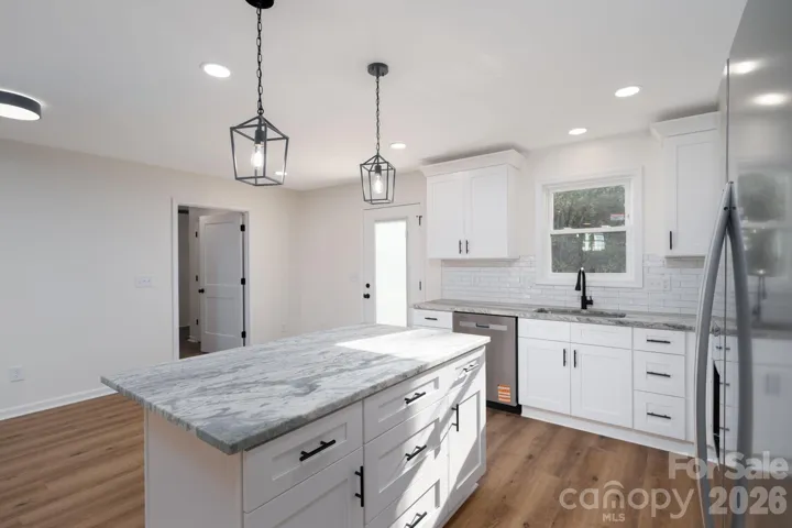 Kitchen with dining area and access to back deck