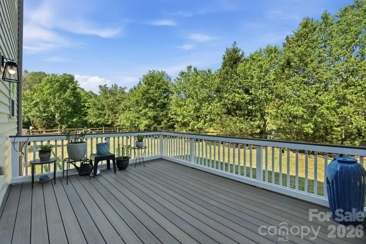 View from the deck of the private backyard surrounded by greenery