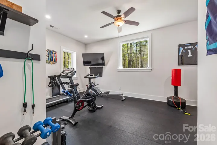 Pool House also includes a large exercise room with rubber floor mat and picture window.