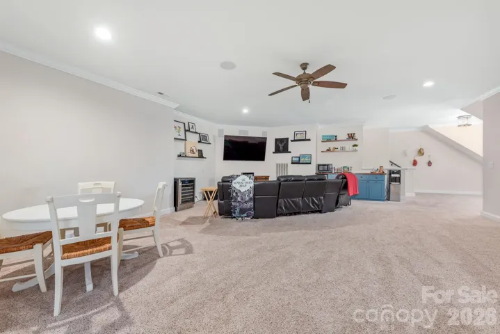 Large Bonus room with room for media area, game space and includes bar with beverage fridge and surround sound. 
