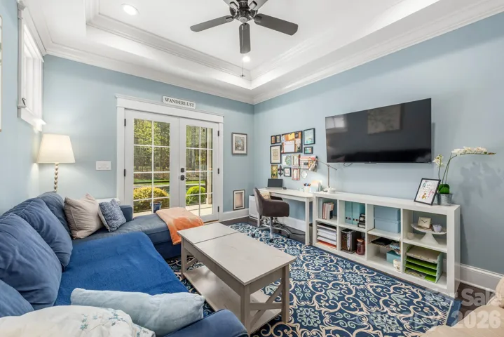 Den has access to screen porch and can be used as an office, additional bedroom or a cozy retreat from everything!