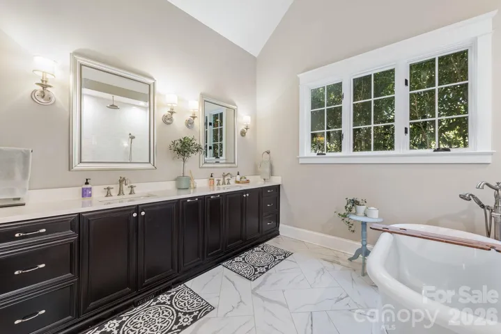 Primary Bath with espresso custom cabinets