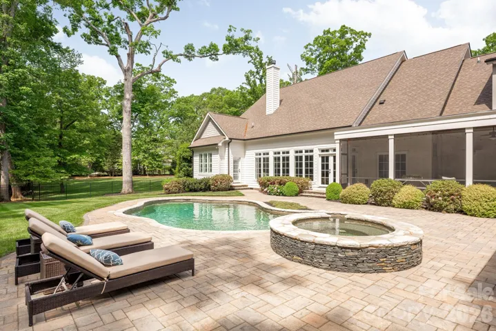 Rear of home with raised spa and lounge area. 