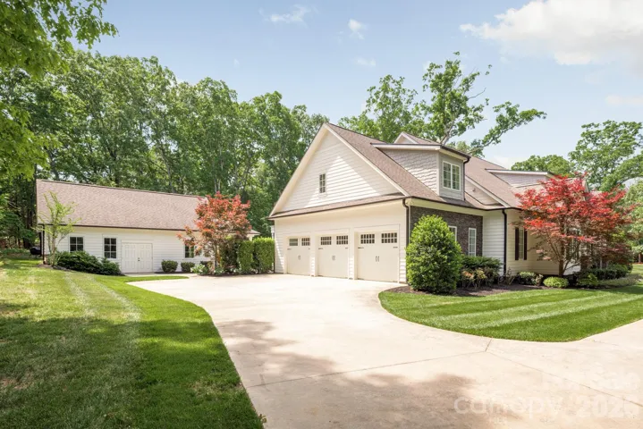 Three side load garage and plenty of driveway parking if needed.