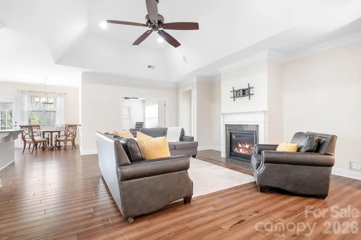 great room with fireplace and an open floor plan