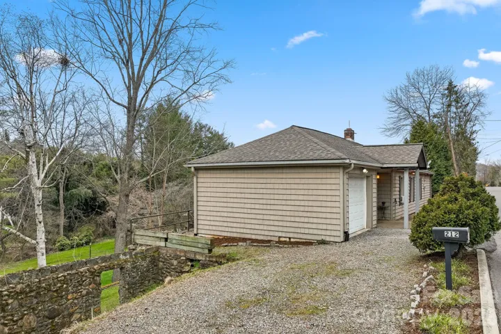 Gravel parking area accessed from Holtzclaw Street