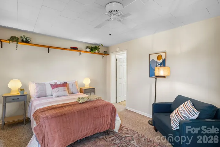 Primary bedroom features berber carpet
