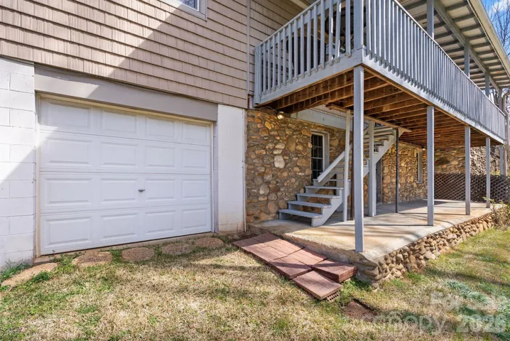 Deck's stairs lead to garage on Johnson Street side