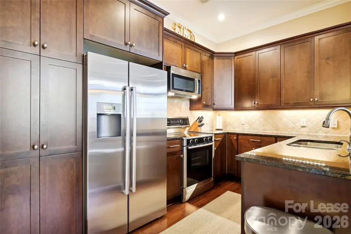Beautiful kitchen with granite counters and SS appliances