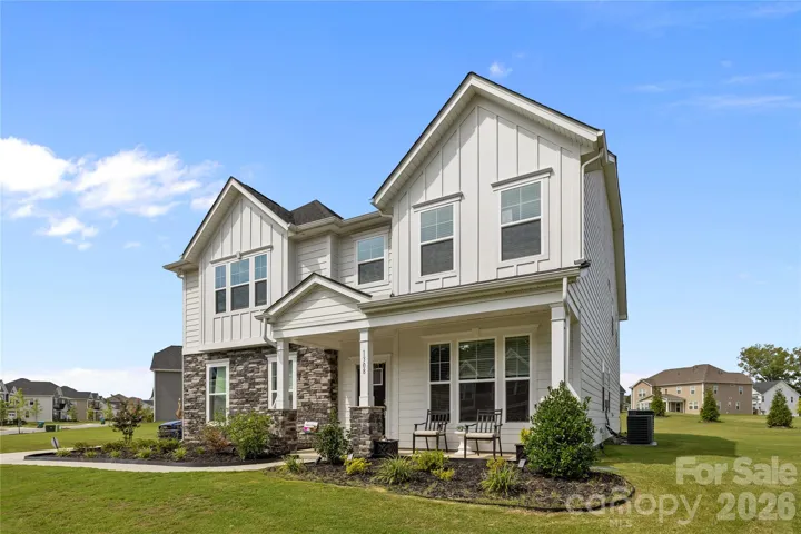 BOARD & BATTEN ACCENTS ABOVE AD CURB APPEAL TO THE FRONT ELEVATION