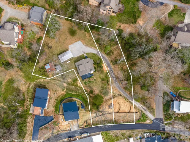 3/1 home with an extra buildable lot one block from Beaver Lake in North Asheville! Lot lines are estimated and not a survey.