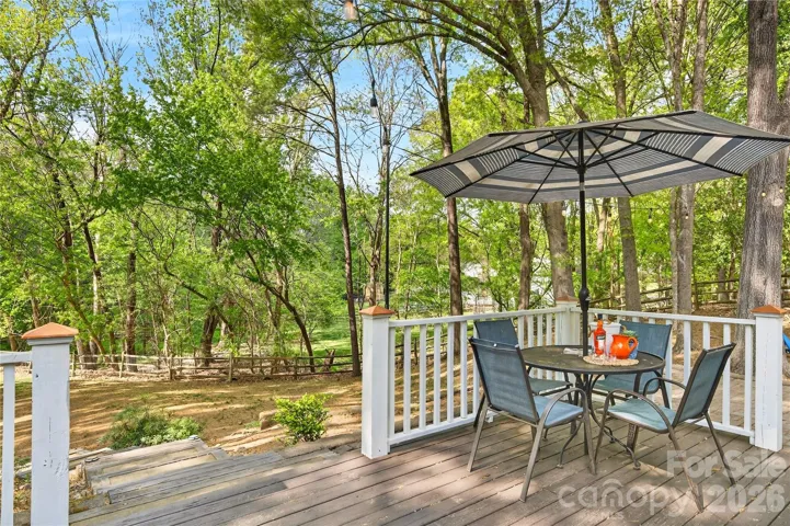 Outdoor deck and spacious backyard