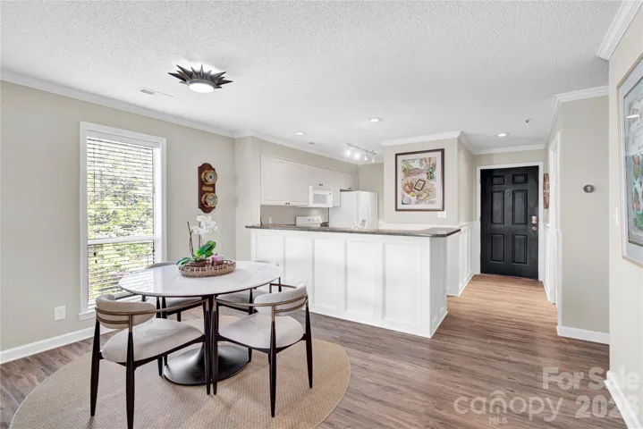 Dining Area with kitchen in background