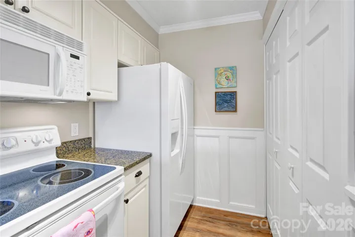 Kitchen with laundry closet to right