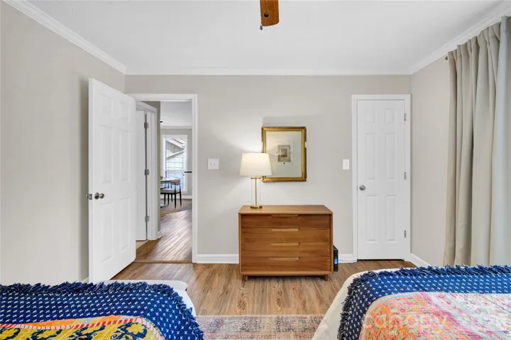 Bedroom with closet and ceiling fan.